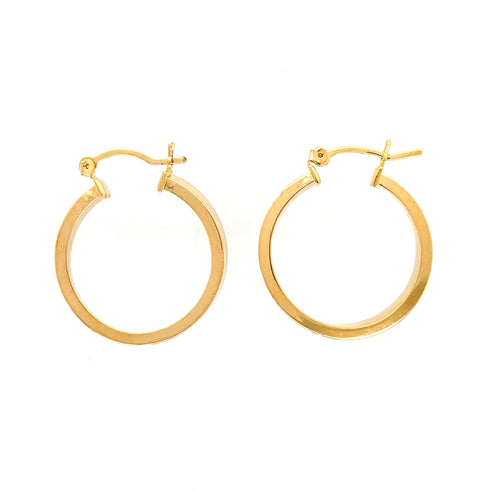The 14k gold filled hoops earrings with a 1-inch round textured design are displayed against a plain white background.